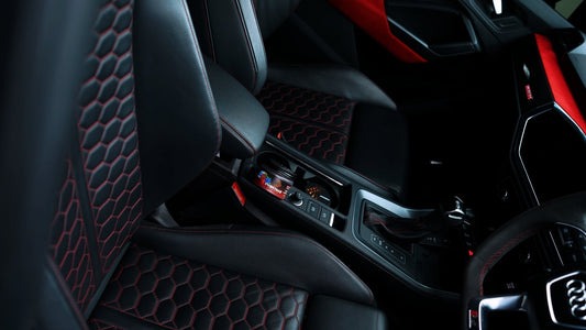 Berry Chill Overtake gel car air freshener on a red car seat