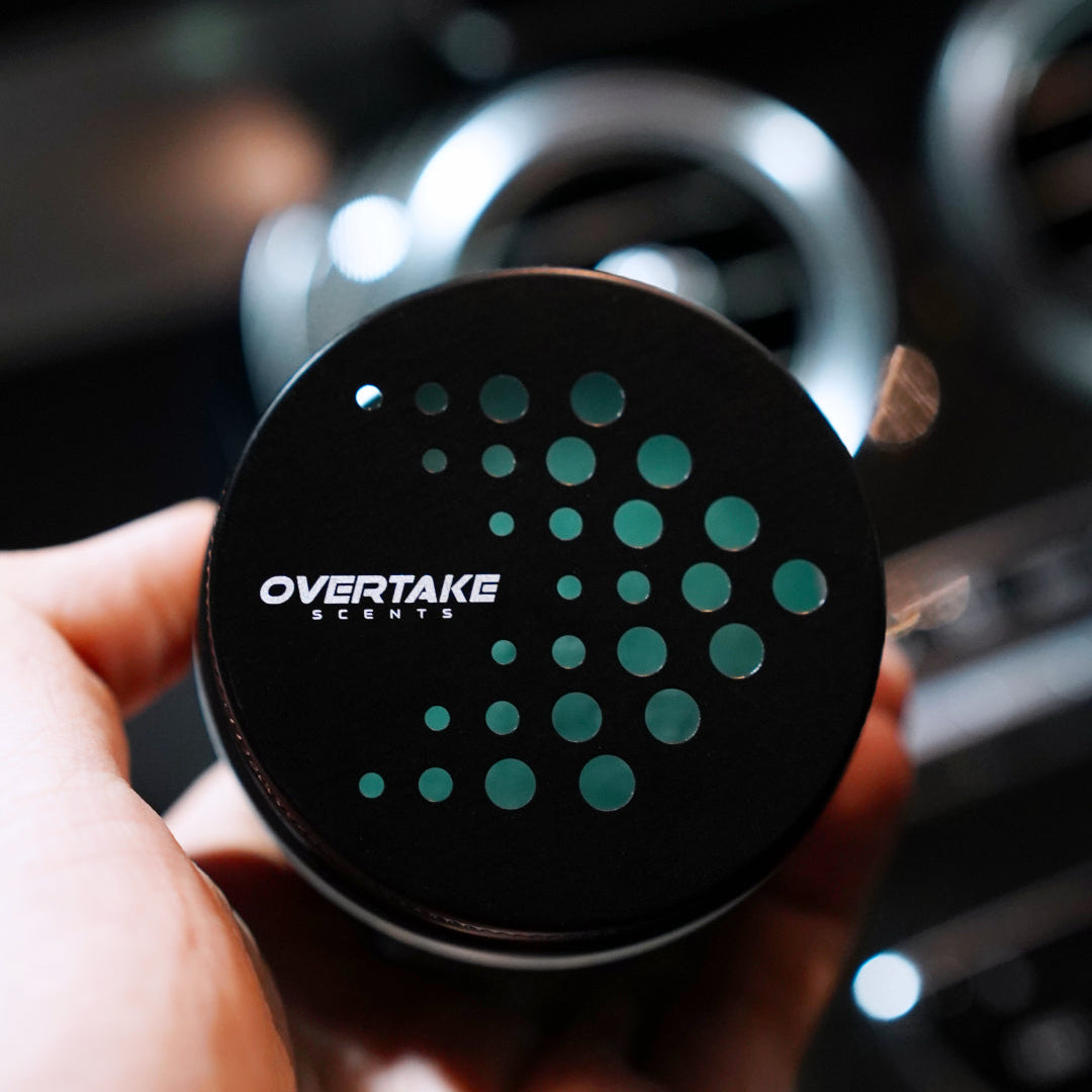Aqua Fresh gel car air freshener lid close-up, perforated design with teal gel visible through holes — Overtake Scents