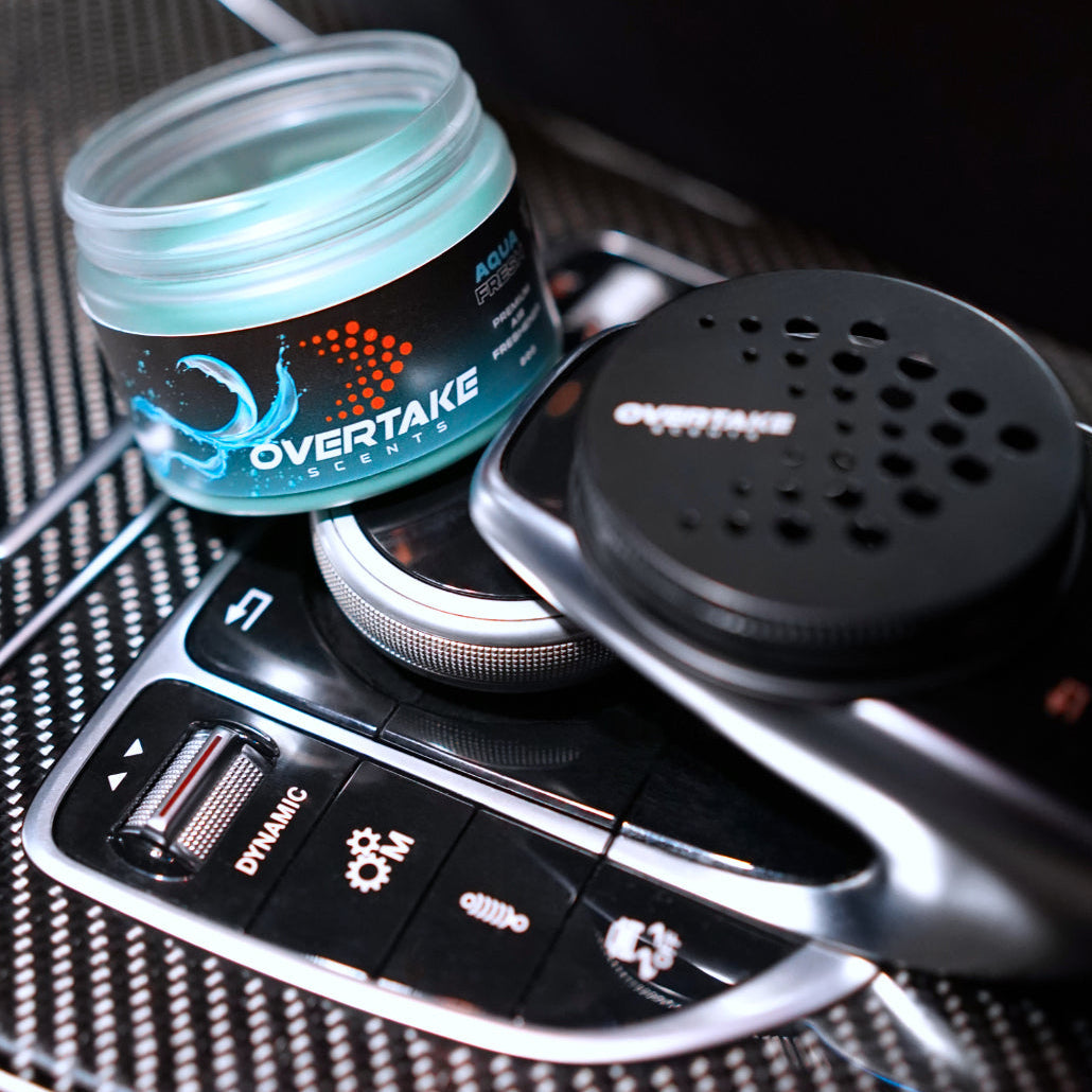 Aqua Fresh gel car air freshener and Overtake vent mount in Audi center console with DYNAMIC drive mode controls — Overtake Scents