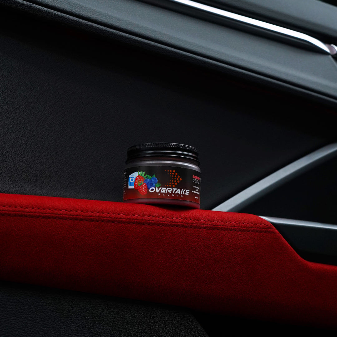 Berry Chill gel car air freshener on red Alcantara suede car door armrest — Overtake Scents