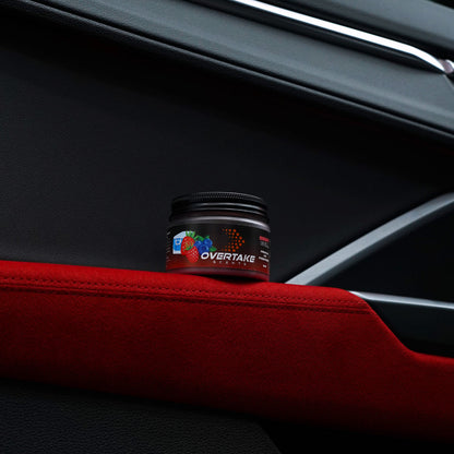 Berry Chill gel car air freshener on red Alcantara suede car door armrest — Overtake Scents
