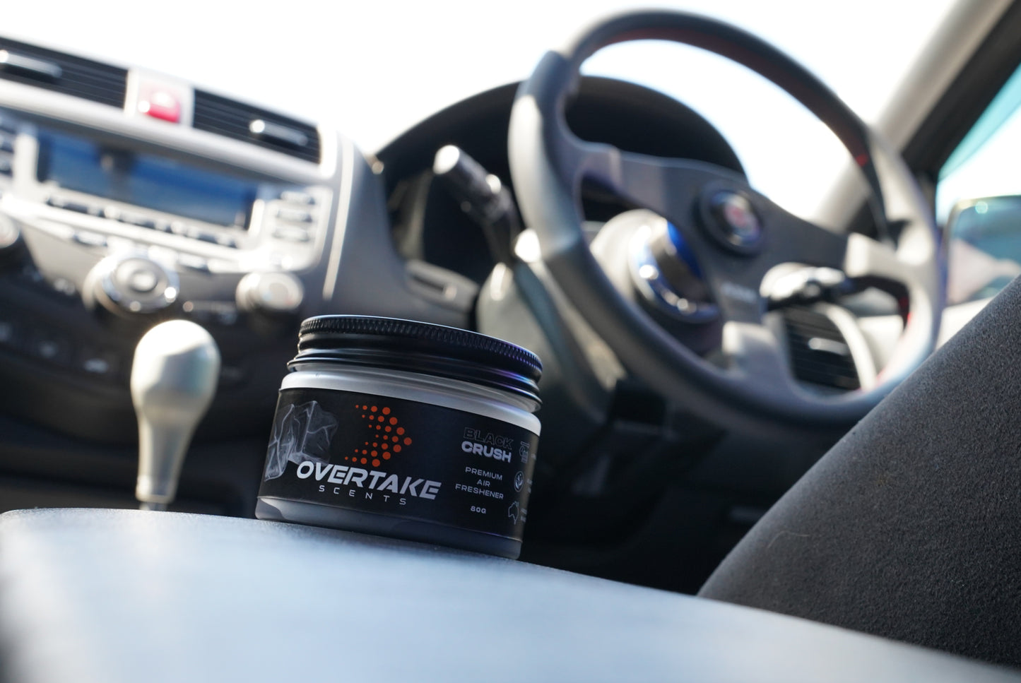 Black Crush gel car air freshener in Honda Accord CL9 center console, Honda steering wheel and manual shifter visible — Overtake Scents