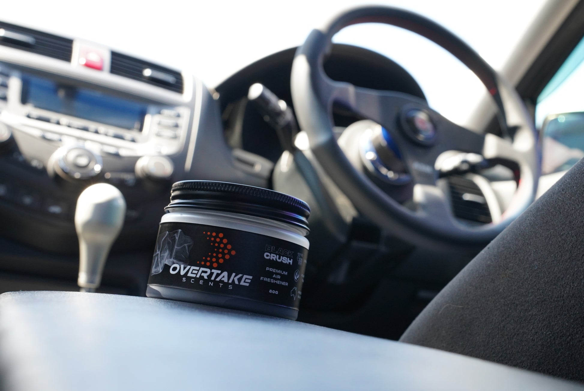 Black Crush gel car air freshener in Honda Accord CL9 center console, Honda steering wheel and manual shifter visible — Overtake Scents