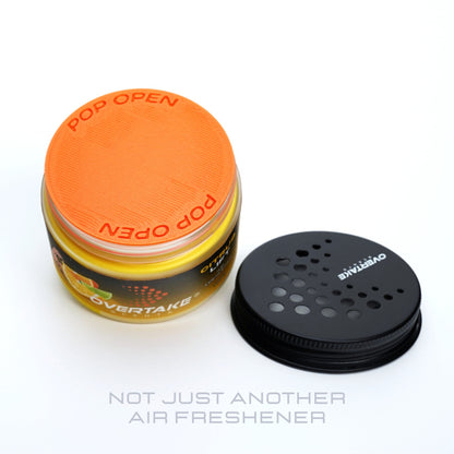 Citrus Lift gel car air freshener with lid removed, freshness seal intact — Overtake Scents