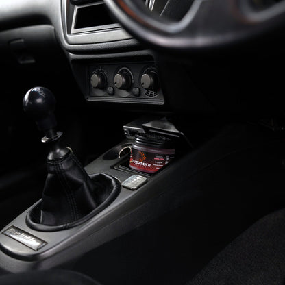 Cool Melon gel car air freshener in Mitsubishi Lancer Evolution center console, manual shifter and HVAC knobs visible — Overtake Scents
