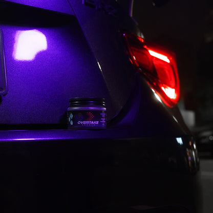 Grape Ice gel car air freshener in car boot with purple ambient lighting from tail lights — Overtake Scents