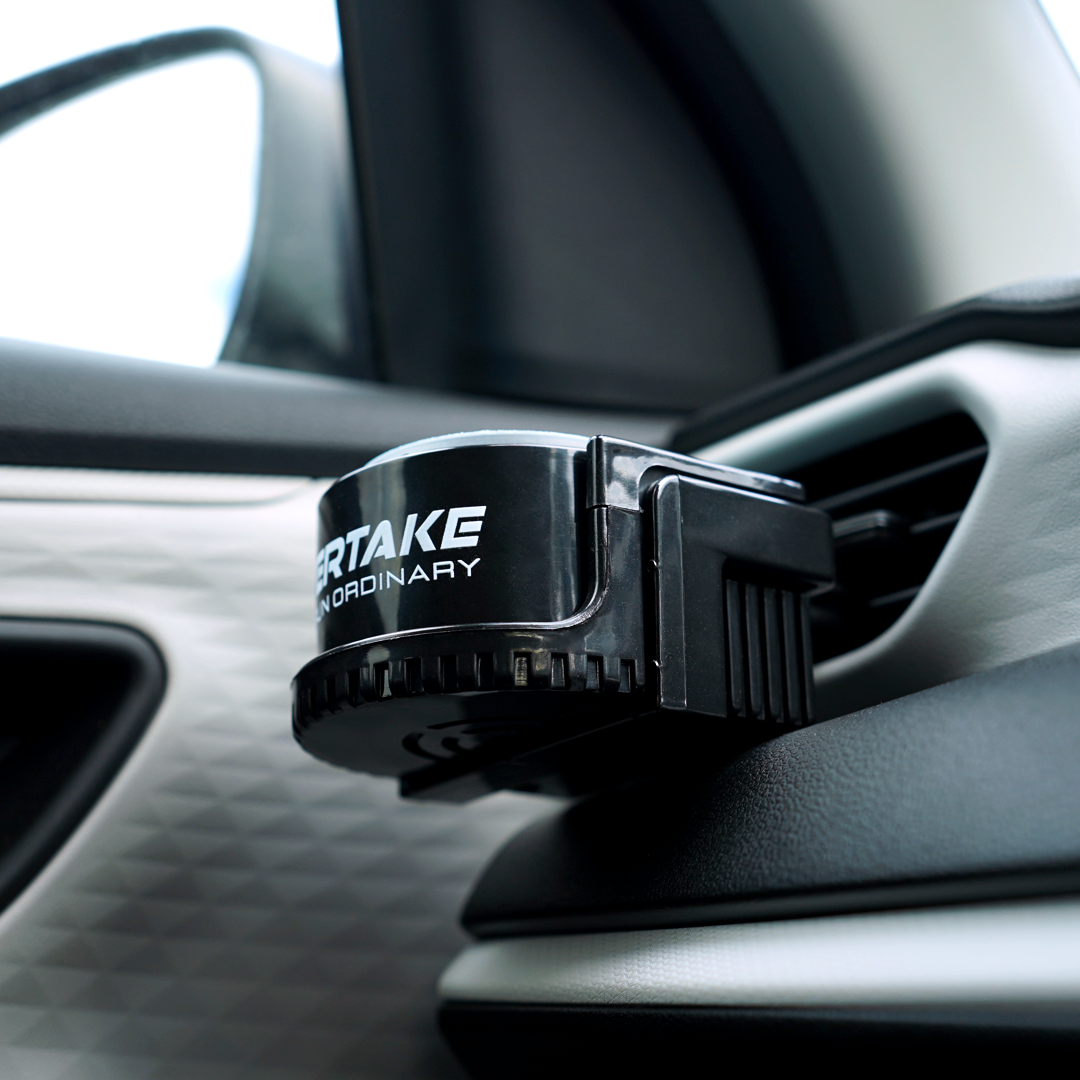 Overtake vent mount car air freshener holder clipped onto passenger side vent — Overtake Scents