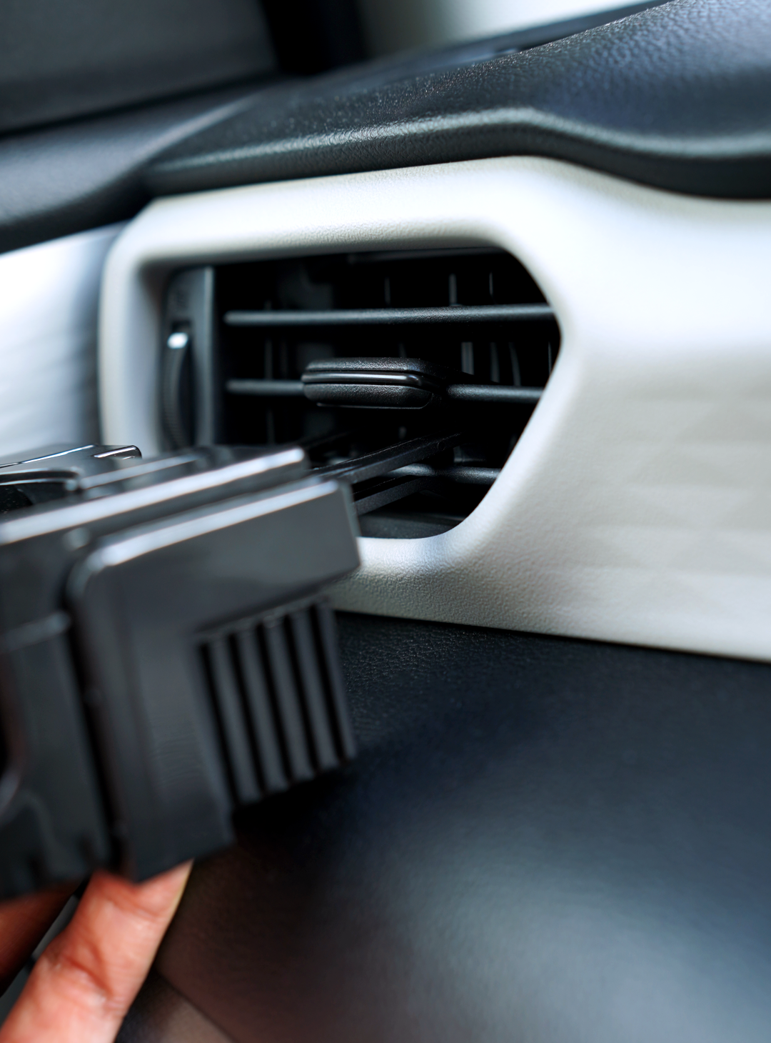 Overtake vent mount being clipped into car air vent — Overtake Scents