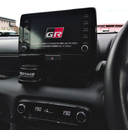 Overtake vent mount and gel air freshener in Toyota GR center console, GR Gazoo Racing infotainment screen visible — Overtake Scents